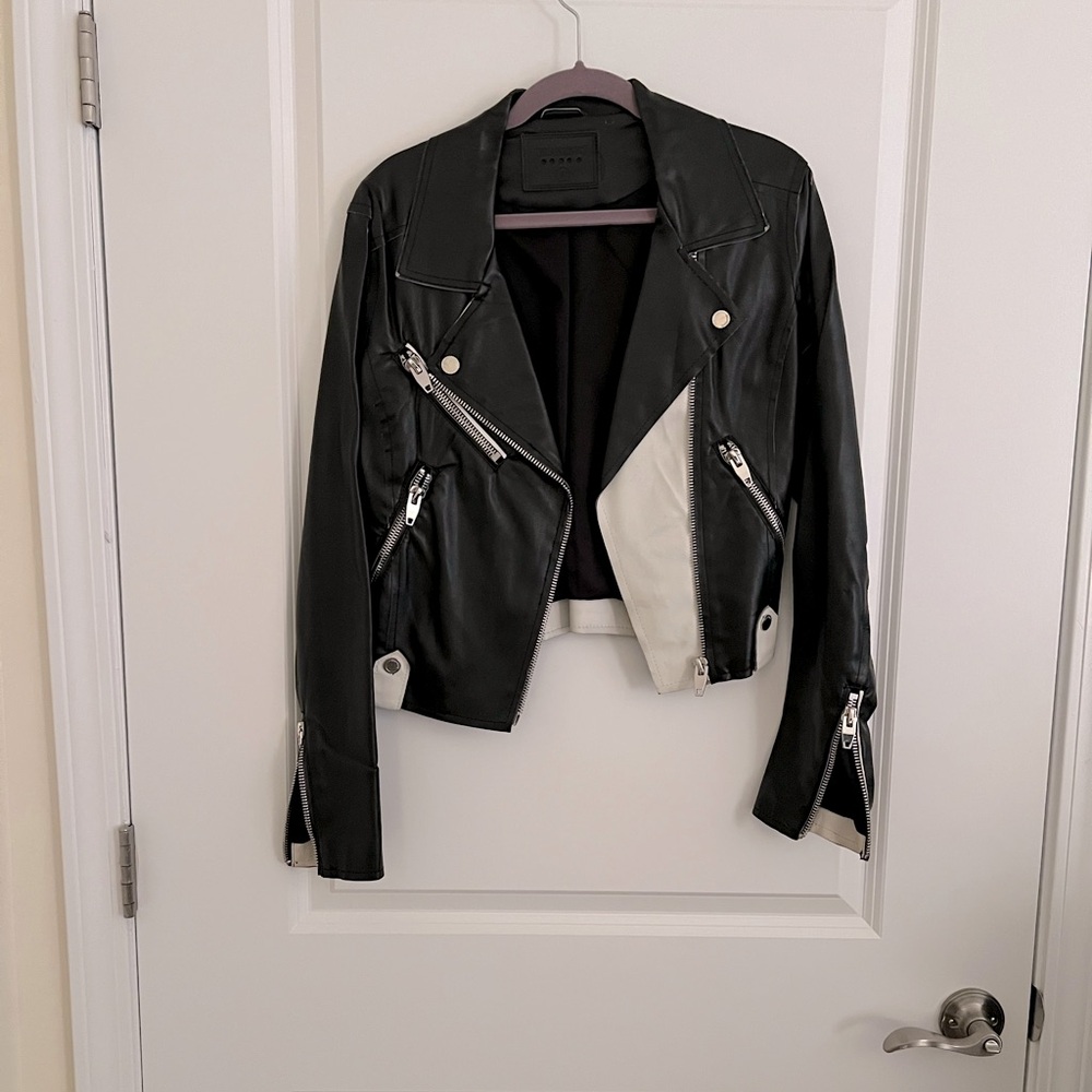 Leather motorcycle jacket.  Black and white.  Cropped